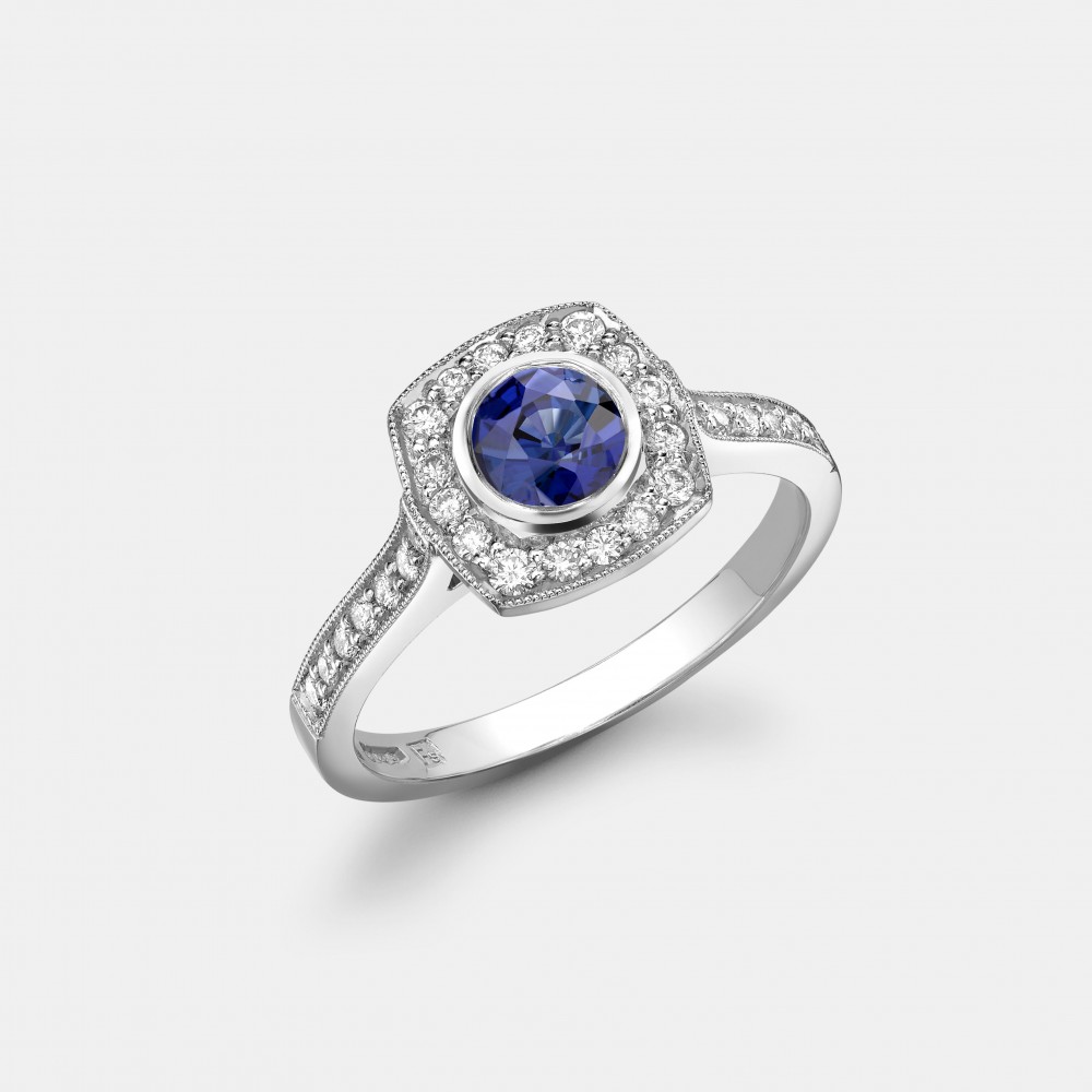 Platinum, Blue Sapphire and Diamond Halo Ring